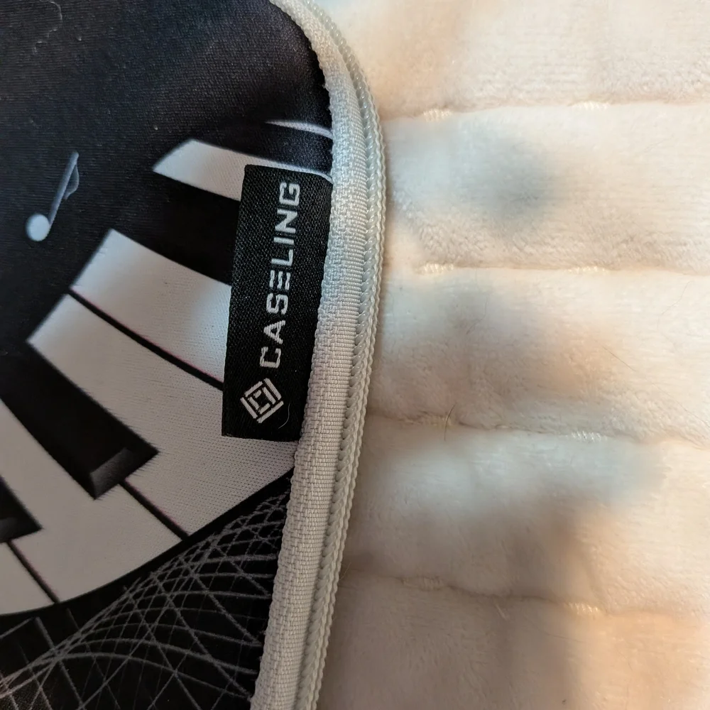 Casetify Black Tablet Sleeve with White Piano Keyboard & Music Notes